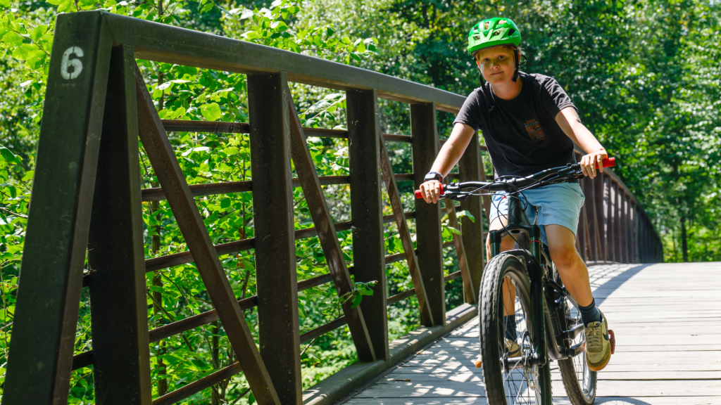 A child Mountain Biking in Stowe, Vermont